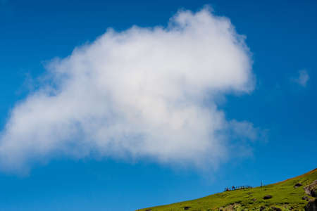 Big cloud fly over the hillの写真素材