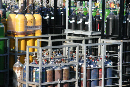 Compressed gasses for industrial use stored for transport.