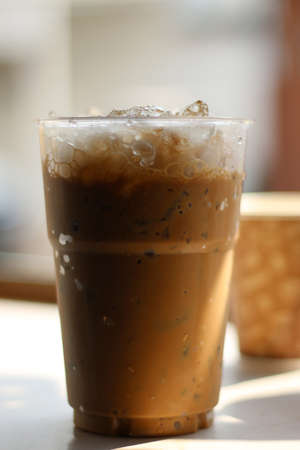 Iced coffee in plastic glassの写真素材