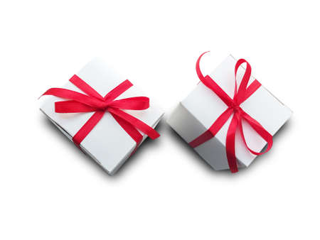 White gift box with red ribbon deliver happiness on the occasionの写真素材