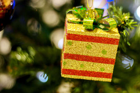 Yellow Christmas Gift Box With Green Ribbon, Christmas Treeの写真素材