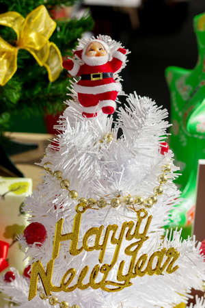 Santa Claus on white christmas tree, Happy new yearの写真素材