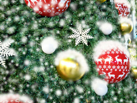 Beautifully decorated Christmas tree with full snow coverの写真素材