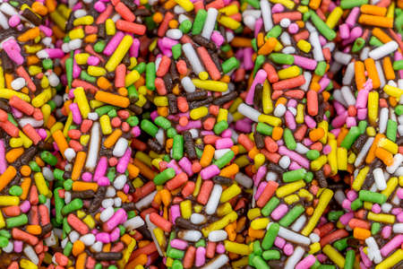 Chocolate biscuit stick with colorful sugarの写真素材