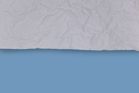 white crumpled and blue smooth  paper background