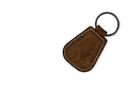 Brown leather key chain on white backgroundの写真素材