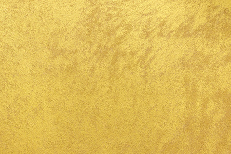 Gold color painted on wood texture backgroundの写真素材