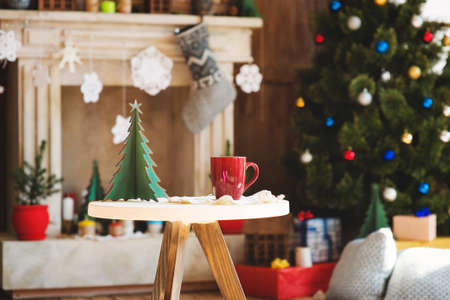 Hot chocolate in a mug with marshmallows in Christmas decorationsの写真素材
