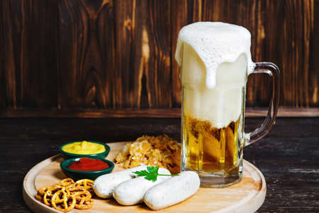 Bavarian sausages with pretzel, sweet mustard and beerの写真素材