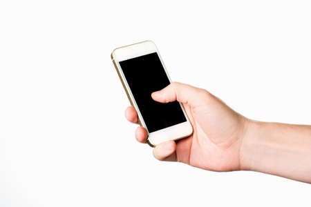 Man hand holding the white smartphone isolated on whiteの写真素材