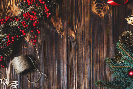 Christmas background on old wooden desk. Flat lay style