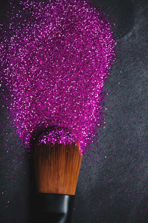 Crisp eyeshadow makeup and brush on a white backgroundの写真素材