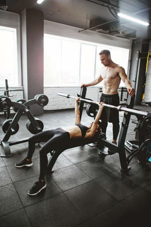 Young sporty couple workout in gym