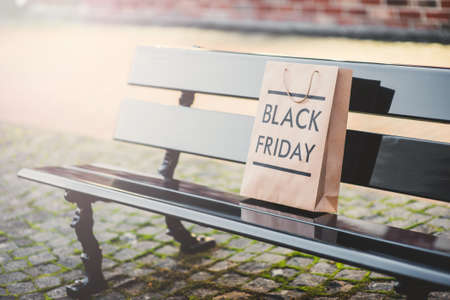 Black Friday paper bag on black banchの写真素材