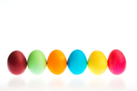 Colorful Easter eggs in a rowの写真素材