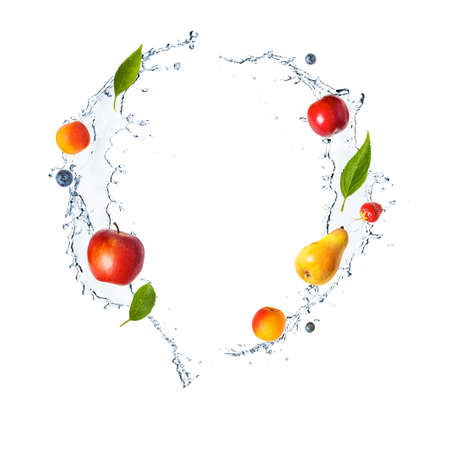 Splash with fruits, berries and fresh mint isolated on whiteの写真素材