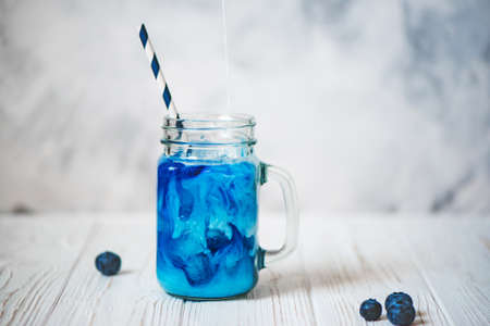 Cold butterfly pea flowers tea with fresh milkの写真素材