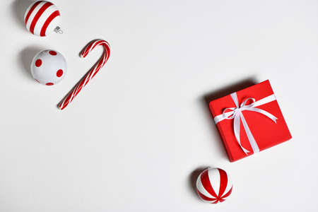 Christmas decorations with candy cane, gift box and christmas toys on white background.の写真素材
