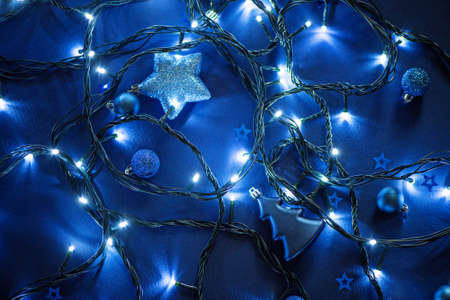 Electric garland lights and Christmas toys in blue colorsの写真素材
