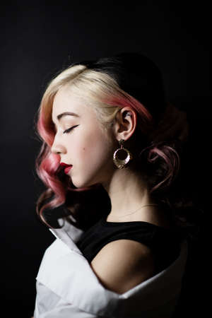 Beautiful woman with long wavy hair in retro styleの写真素材