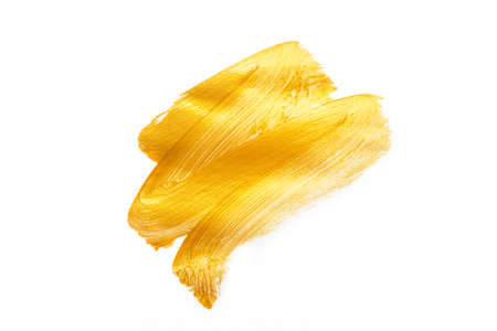 Beautiful textured golden stroke isolated on white background.の写真素材