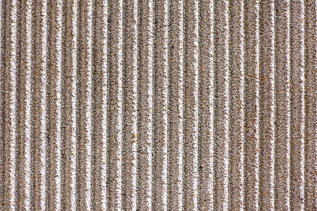 Textured concrete wall with vertical lines as a texture or background.