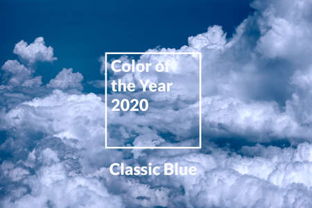 Blue sky background with white clouds. Color of the year 2020.の写真素材