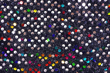 Multicolored sequins textile background.