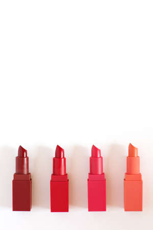 Row of colorful lipsticks on white background.の写真素材