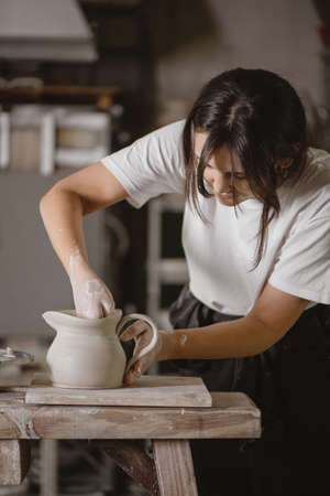 Female potter making a clay jug.の写真素材