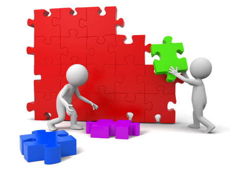 Teamwork Two people are moving the puzzlesの写真素材