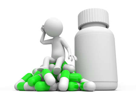 Capsule bottle a man thinking, sitting on a pile of capsulesの写真素材
