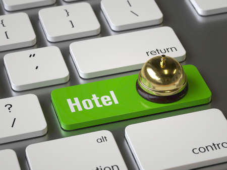 Hotel key on the keyboardの写真素材