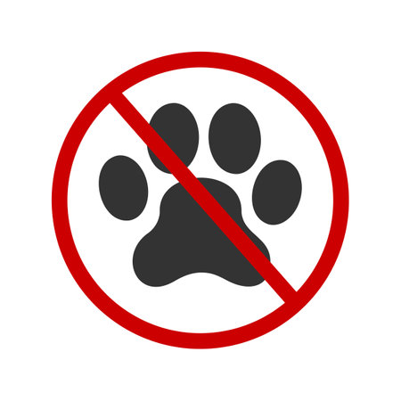 No pets allowed icon. Domestic animals ban zone pictogram. Prohibited symbol with paw print silhouette in red forbidden sign isolated on white background. Vector graphic illustrationのイラスト素材