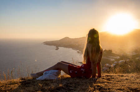 Hiker view over Madeira Funchal bay island sea sunset fall moodの写真素材