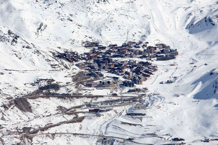 View from the mountain over val thorens with the surrounding slopes. Beautiful blue sky in sunset light with a great mood and snowy mountainscape landscape of the French alpes.の写真素材