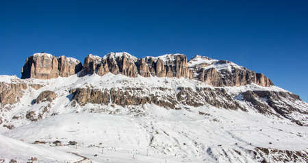 Perfect sunset panoramic view of Italy dolomites sella stock sella ronda in italy. blue sky in...