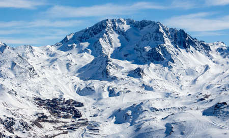 View from the mountain over val thorens with the highest peak of the alps Mont Blanc in the...