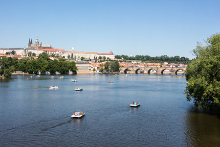 Charles bridge and prague castle sunny panorama old townの写真素材