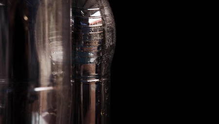 Water bottle, plastic bottles,water drops, empty bottles, black backdrop,close upの写真素材