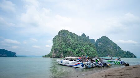 Thailand Phang Nga 3 Nov 2018, a traveler is taking a photo of a speedboat parked at koh naep in Phang Nga Province, Thailand.のeditorial素材