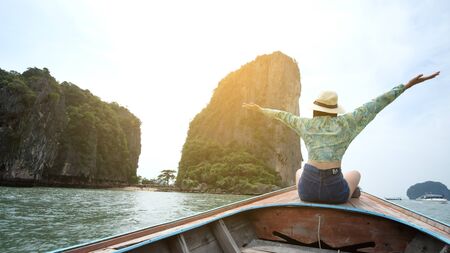 Thailand Phang Nga 3 Nov 2018, a female traveler wearing a floral shirt, is taking a photo of...