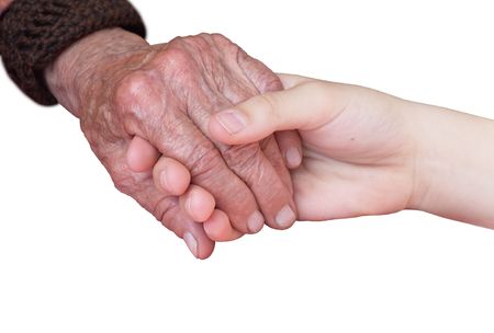 young and old hand on a white backgroundの写真素材
