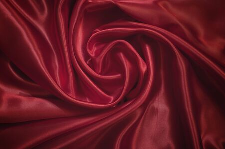 Smooth elegant red silk can use as background の写真素材