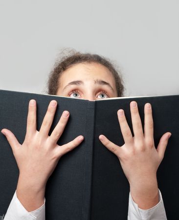 girl reading a terrible bookの写真素材