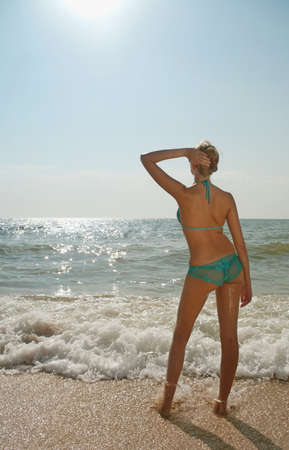 Young  woman in swimwear on the beach の写真素材