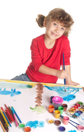 Little girl draws a colored paintの写真素材