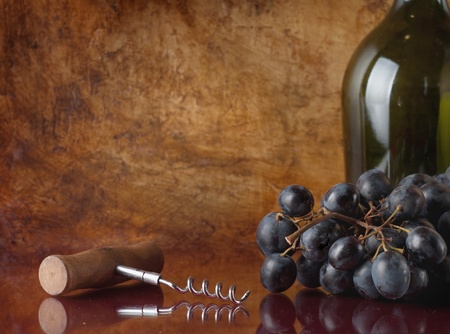 bottle of red wine and corkscrew 