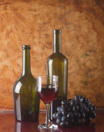 glass of red wine and bottle の写真素材