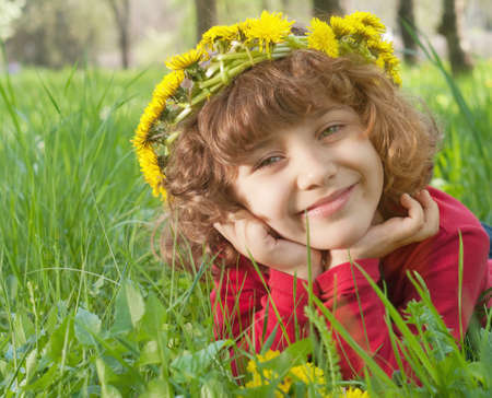 lucky girl reposes on grass の写真素材